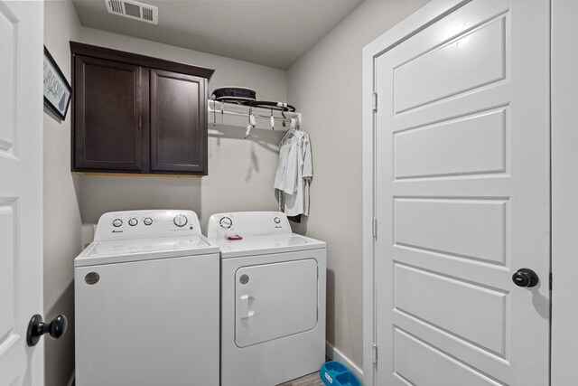 1201 Bajada St, Midland, TX 79705 - washroom with washing machine and dryer and cabinet space