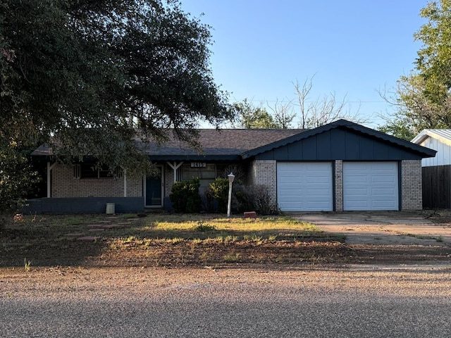 single story home featuring a garage