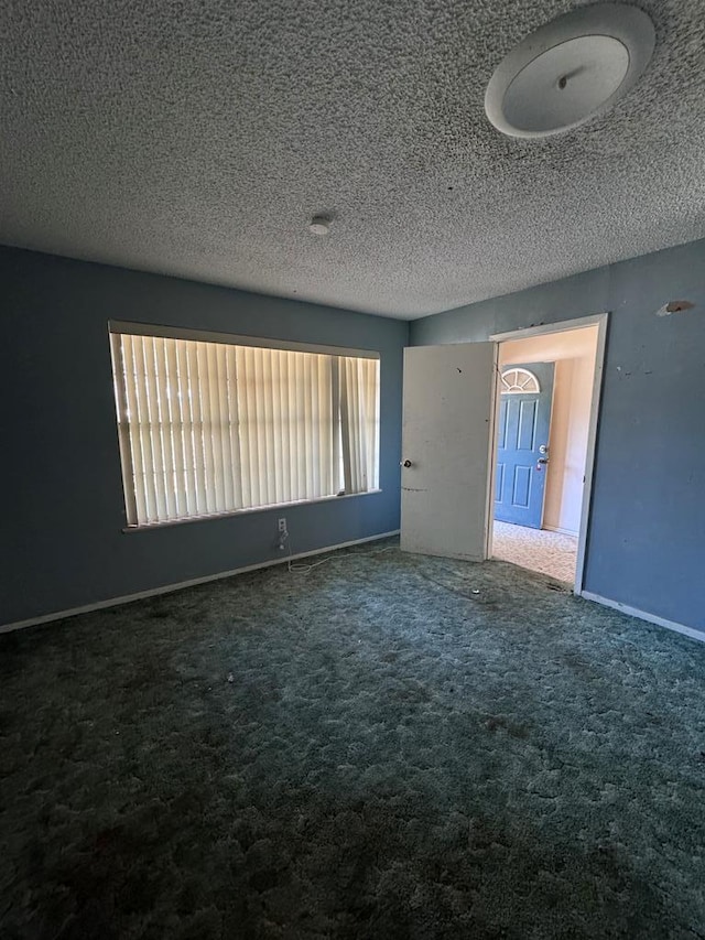 interior space featuring a textured ceiling