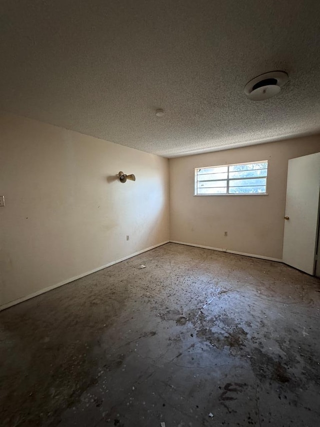 empty room featuring a textured ceiling