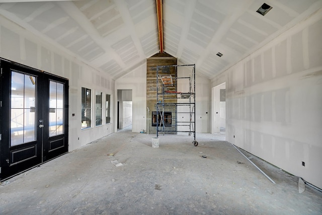 5708 E County Rd 93, Midland, TX 79706 - unfurnished living room featuring high vaulted ceiling and french doors