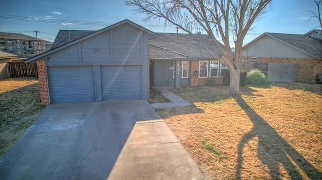 view of front of home featuring a garage and a front yard