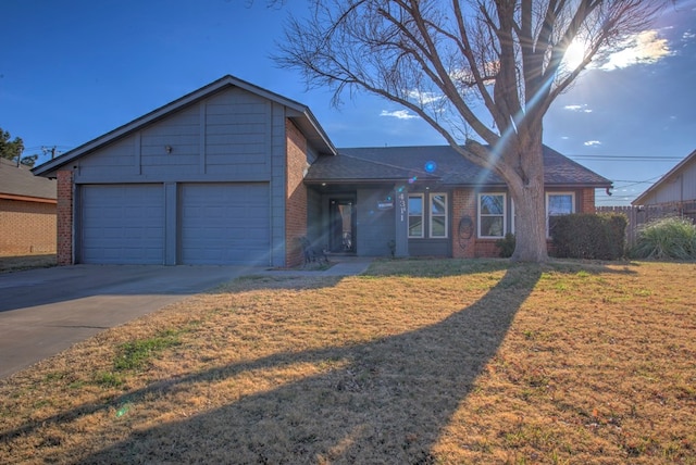 ranch-style house with a garage and a front yard