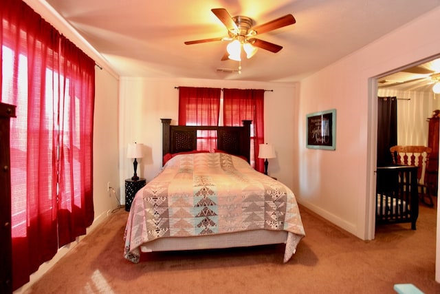 7501 N County Rd 29, Big Spring, TX 79720 - carpeted bedroom with baseboards and a ceiling fan