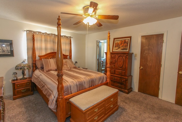 bedroom featuring dark carpet and ceiling fan