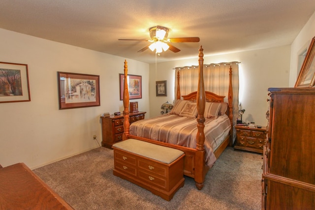 bedroom featuring dark colored carpet and a ceiling fan