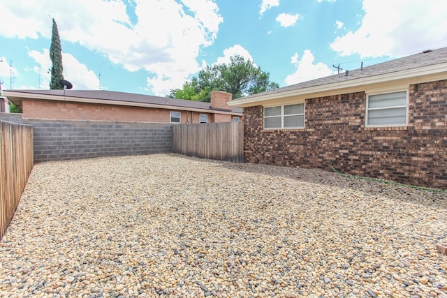 exterior space featuring a fenced backyard