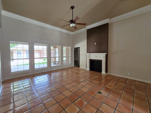 unfurnished living room with ceiling fan, a high ceiling, ornamental molding, and tile patterned flooring