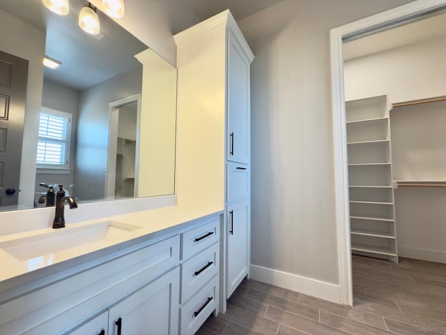 5516 E County Rd 93, Midland, TX 79706 - bathroom featuring vanity and wood finish floors