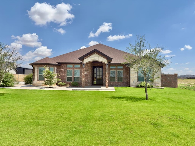 5516 E County Rd 93, Midland, TX 79706 - view of front facade with a front yard and brick siding