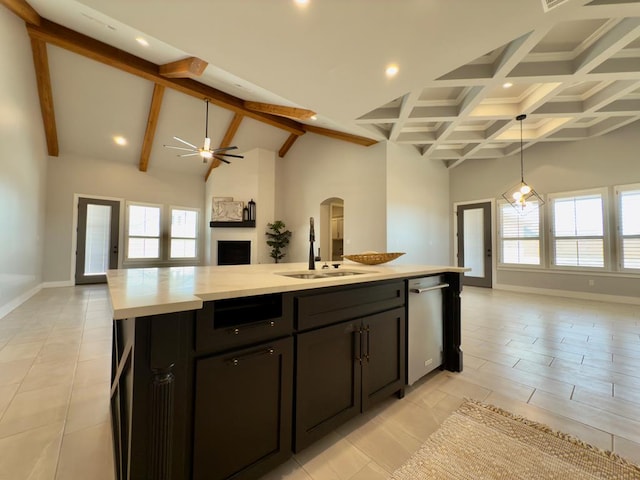 5516 E County Rd 93, Midland, TX 79706 - kitchen with open floor plan, stainless steel dishwasher, light countertops, high vaulted ceiling, and beamed ceiling