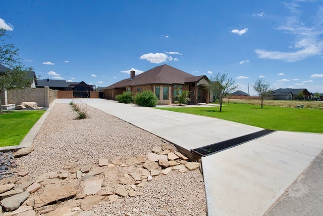 5516 E County Rd 93, Midland, TX 79706 - single story home with brick siding and a chimney