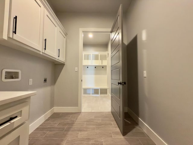 5516 E County Rd 93, Midland, TX 79706 - laundry area featuring hookup for an electric dryer, hookup for a washing machine, and cabinet space