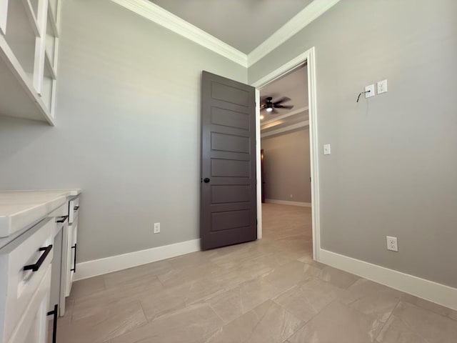 5516 E County Rd 93, Midland, TX 79706 - kitchen featuring crown molding, white cabinetry, light countertops, and a ceiling fan