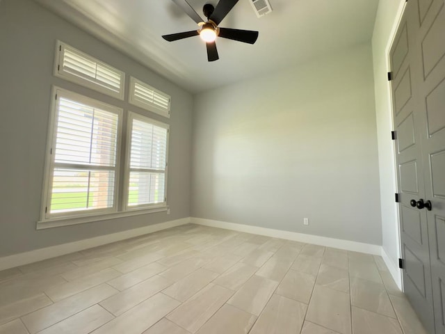 5516 E County Rd 93, Midland, TX 79706 - empty room featuring a ceiling fan and baseboards