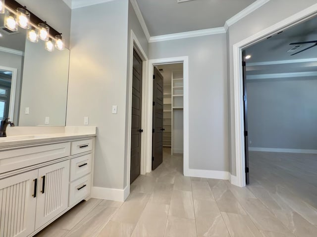 5516 E County Rd 93, Midland, TX 79706 - full bathroom with crown molding, vanity, and a spacious closet