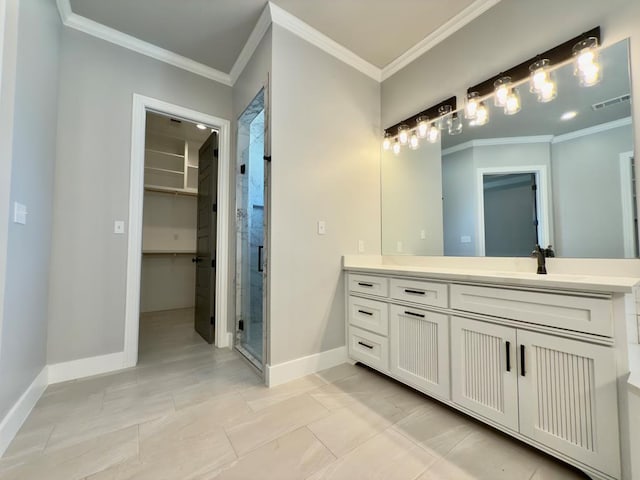 5516 E County Rd 93, Midland, TX 79706 - bathroom with vanity, a stall shower, ornamental molding, and a spacious closet