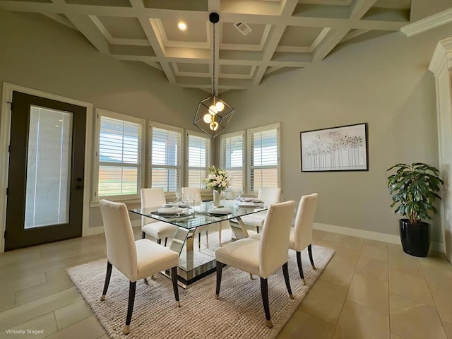 5516 E County Rd 93, Midland, TX 79706 - dining space with coffered ceiling, beamed ceiling, and light tile patterned flooring