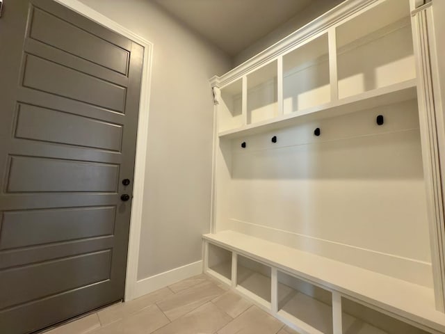 5516 E County Rd 93, Midland, TX 79706 - mudroom featuring baseboards and light tile patterned floors