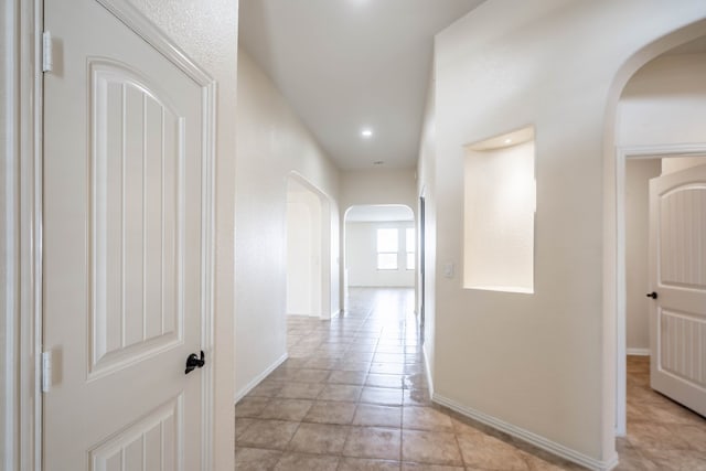 4906 Meadowside St, Midland, TX 79705 - corridor with arched walkways, light tile patterned flooring, and recessed lighting