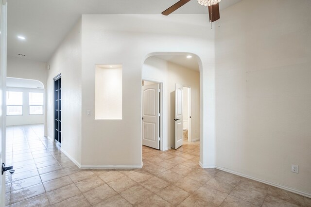 4906 Meadowside St, Midland, TX 79705 - corridor with arched walkways, light tile patterned floors, and recessed lighting