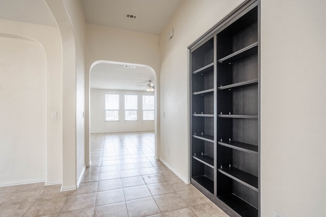 4906 Meadowside St, Midland, TX 79705 - hall with arched walkways and tile patterned flooring