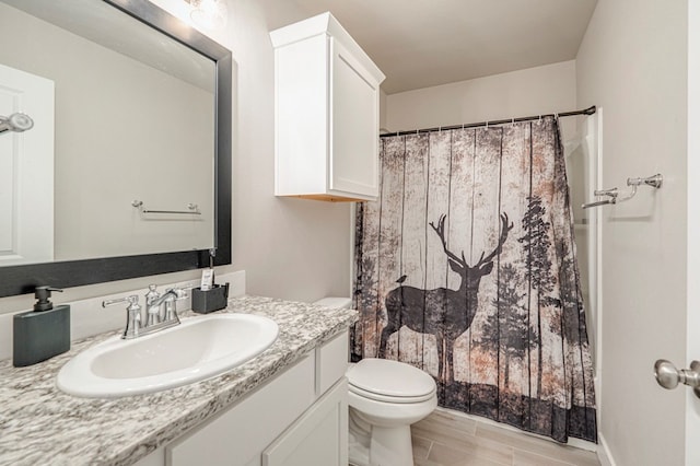 6909 Moonlight, Midland, TX 79705 - full bath featuring toilet, vanity, and a shower with shower curtain