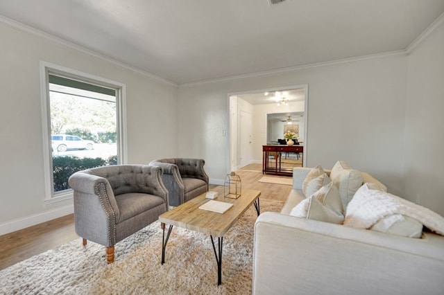 2 Auburn Ct, Midland, TX 79705 - living area featuring baseboards, light wood-style floors, and ornamental molding