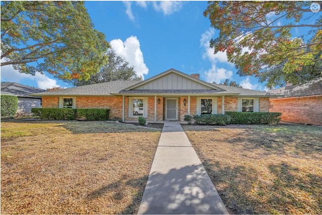 2 Auburn Ct, Midland, TX 79705 - single story home with a chimney, brick siding, and a front yard