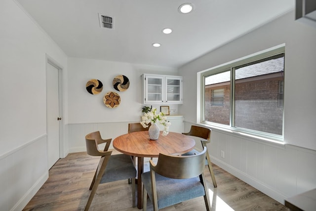2 Auburn Ct, Midland, TX 79705 - dining space featuring recessed lighting, wainscoting, visible vents, and wood finished floors