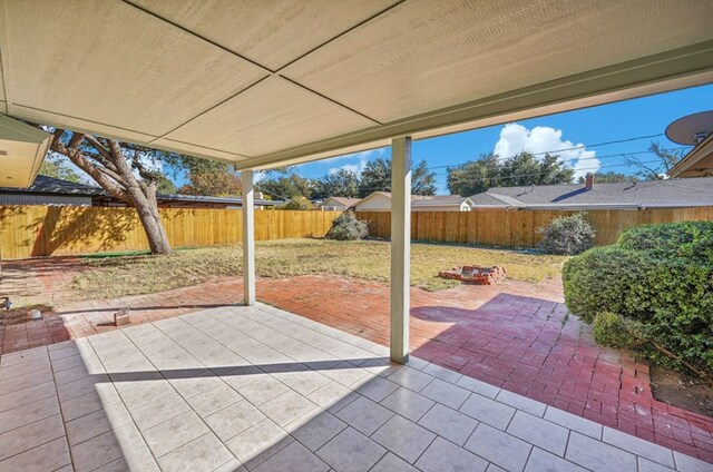 2 Auburn Ct, Midland, TX 79705 - view of patio / terrace with an outdoor fire pit and a fenced backyard