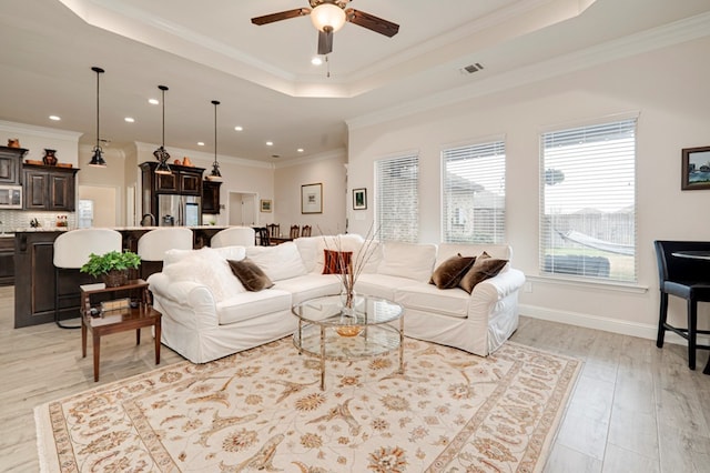 4506 San Pedro Ct, Midland, TX 79707 - living room with ceiling fan, visible vents, crown molding, a tray ceiling, and recessed lighting