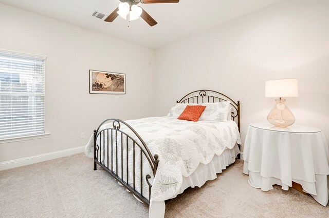 4506 San Pedro Ct, Midland, TX 79707 - bedroom with baseboards, ceiling fan, light carpet, and visible vents