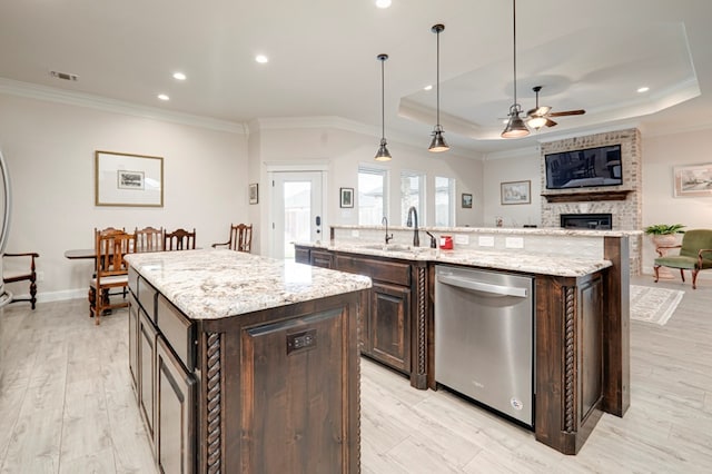 4506 San Pedro Ct, Midland, TX 79707 - kitchen with a kitchen island with sink, a ceiling fan, stainless steel dishwasher, a sink, and ornamental molding