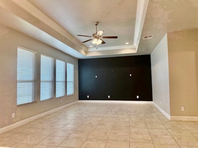 37 Devon Ct, Odessa, TX 79765 - unfurnished room featuring a ceiling fan, a tray ceiling, and light tile patterned floors
