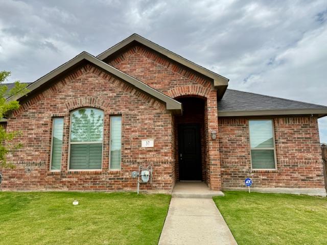 37 Devon Ct, Odessa, TX 79765 - single story home featuring brick siding, a front yard, and a shingled roof