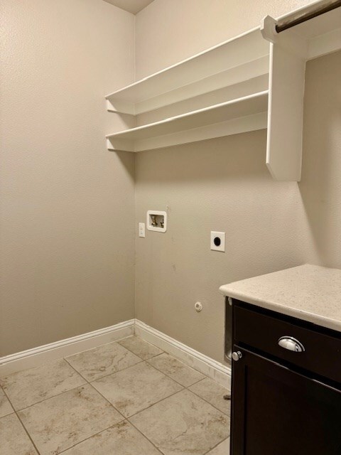 37 Devon Ct, Odessa, TX 79765 - washroom with hookup for an electric dryer, hookup for a washing machine, cabinet space, and hookup for a gas dryer