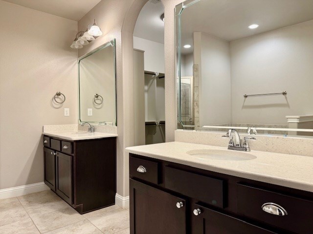 37 Devon Ct, Odessa, TX 79765 - full bath with two vanities and tile patterned flooring