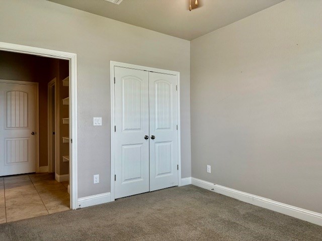 37 Devon Ct, Odessa, TX 79765 - unfurnished bedroom with carpet flooring and a closet