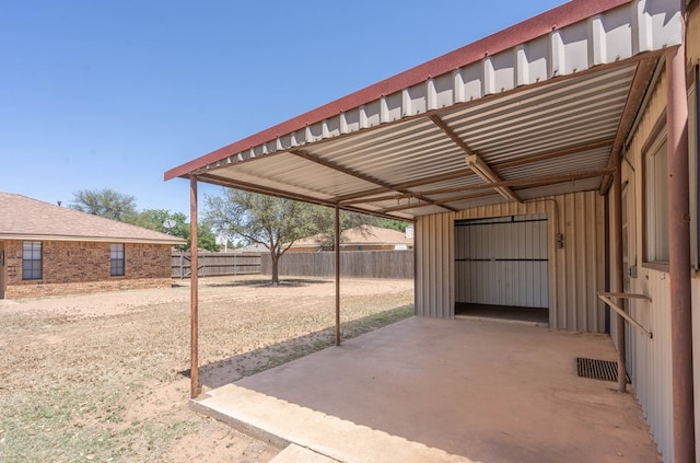 view of patio / terrace featuring visible vents and fence