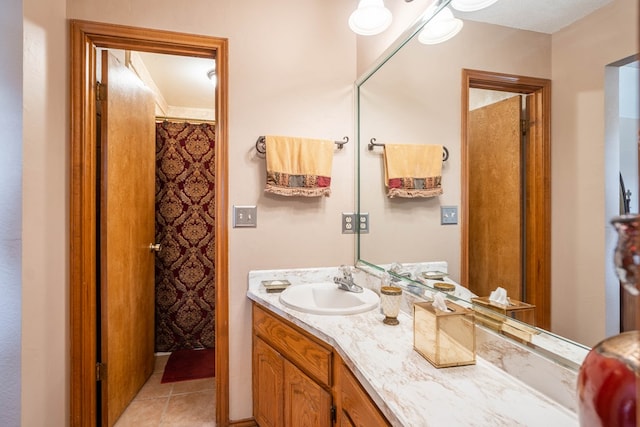 full bathroom featuring vanity and tile patterned flooring