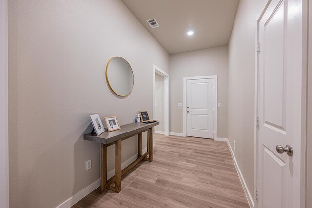 6803 Leather Ln, Midland, TX 79705 - corridor with light wood-type flooring, baseboards, and recessed lighting