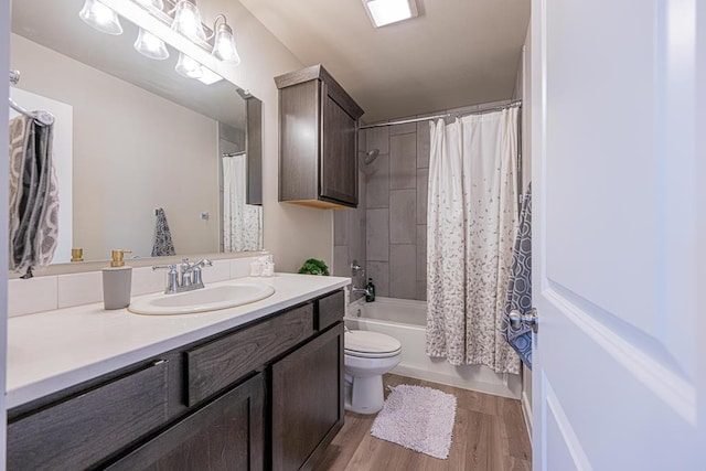 6803 Leather Ln, Midland, TX 79705 - full bath with wood finished floors, vanity, toilet, and shower / bath combo