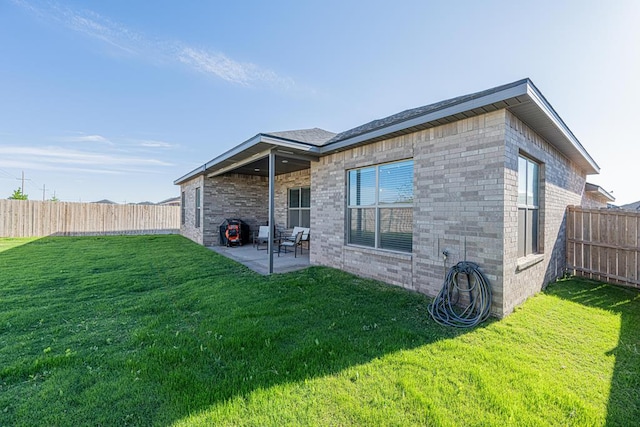 6803 Leather Ln, Midland, TX 79705 - back of house with a patio area and brick siding
