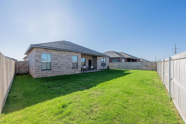 6803 Leather Ln, Midland, TX 79705 - rear view of house featuring brick siding and a shingled roof