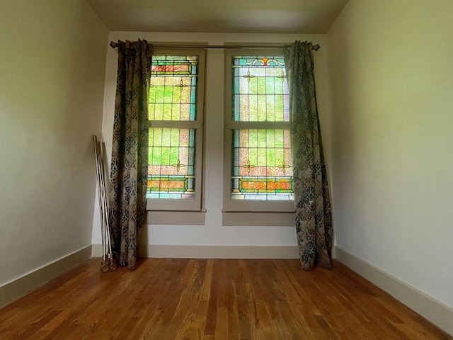 spare room featuring hardwood / wood-style floors