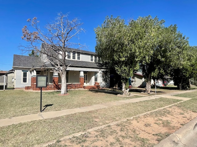 view of front facade with a porch and a front lawn