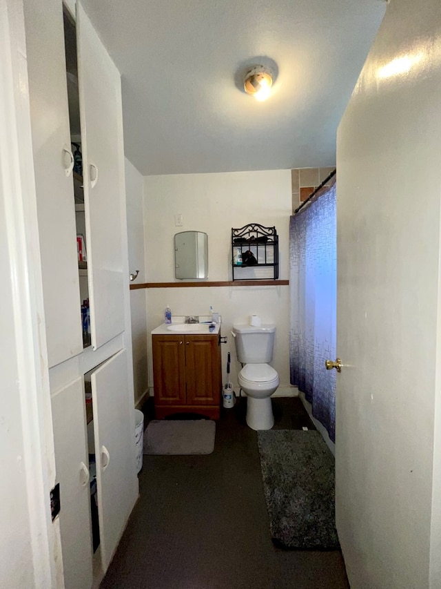 bathroom featuring vanity and toilet