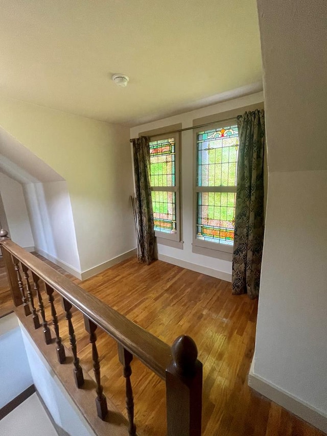 stairway featuring hardwood / wood-style flooring