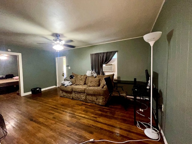 living room featuring ceiling fan, cooling unit, and dark hardwood / wood-style flooring